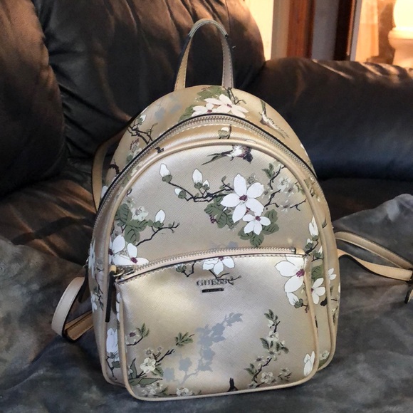 Guess Handbags - Multi colored GUESS backpack purse.
